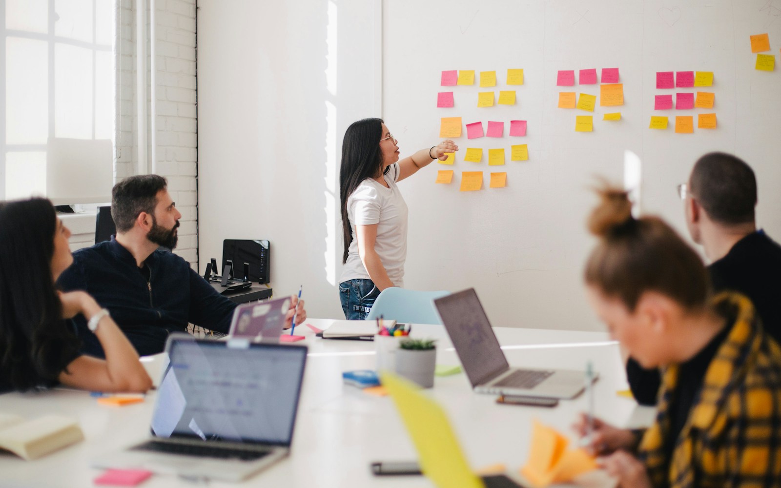 A team reviewing a workflow map together during a diagnostic working session.